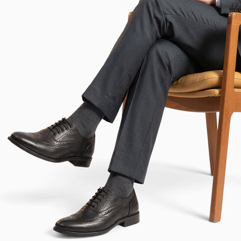 Elegant handmade brogue shoes showcasing intricate craftsmanship and classic design for refined style.
