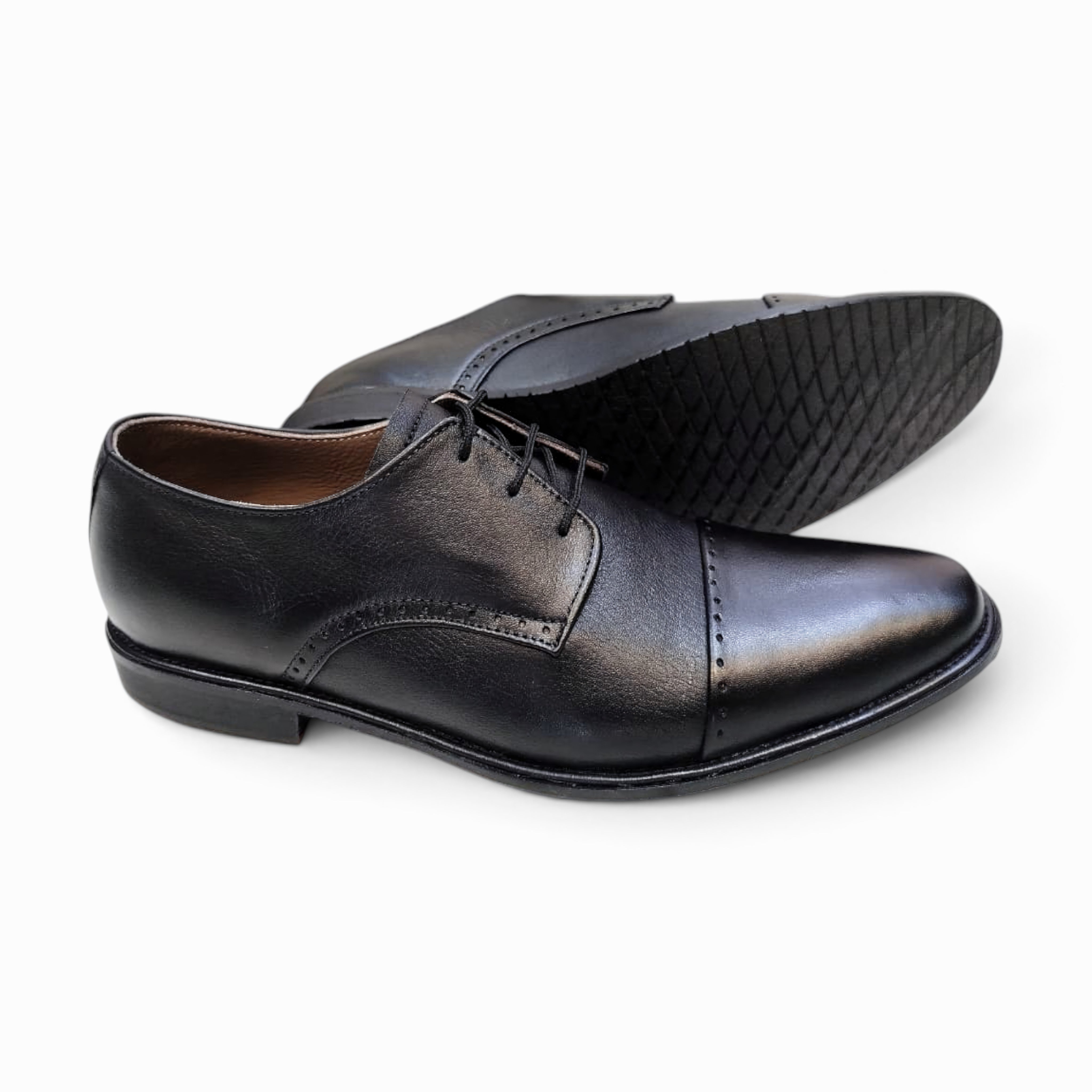 Elegant handmade leather Derby shoes crafted for comfort and style, perfect for formal occasions.