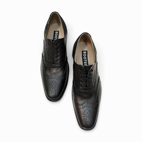 Elegant handmade brogue shoes showcasing intricate craftsmanship and classic design for refined style.