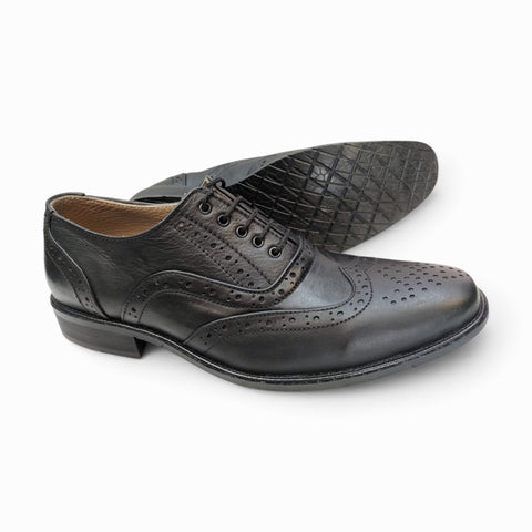 Elegant handmade brogue shoes showcasing intricate craftsmanship and classic design for refined style.