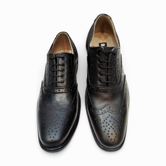 Elegant handmade brogue shoes showcasing intricate craftsmanship and classic design for refined style.
